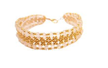 Load image into Gallery viewer, Blush is not pink. It is warmth. It is softness with a backbone.
Laced in Blush is the bracelet that feels like a treat every time you put it on. The opaque duo beads in blush and gold give it a soft, grounded elegance that works as beautifully with a linen dress as it does with a smart blazer.
Handcrafted by Veronica of River Jewels, this bracelet is woven in a lace-inspired pattern using fine seed beads and opaque two-hole duo beads in a soft blush and warm gold. Finished with a lobster clasp.
